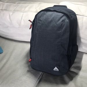 OGIO Heather grey backpack w orange lining and orange metallic zipper pulls